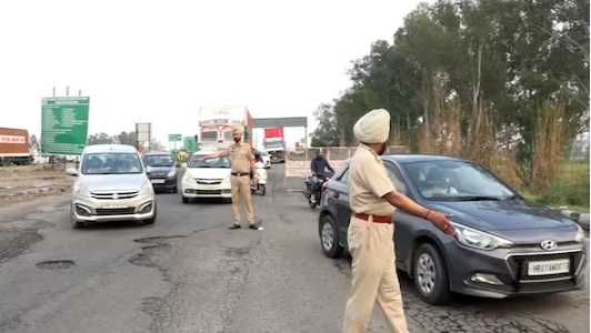 Police of two states guard the Haryana-Punjab border, checking vehicles on the highway