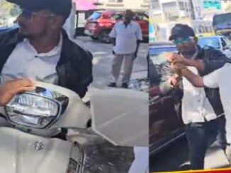 When the traffic police caught the scooty rider without a helmet, his hand was bitten, he was arrested.
