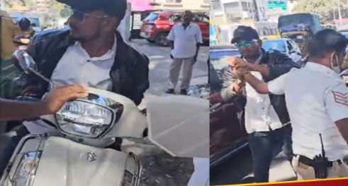 When the traffic police caught the scooty rider without a helmet, his hand was bitten, he was arrested.