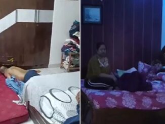 Doctor's body found at home with blood-stained son; wife discovered lying on the bed, using her mobile phone.
